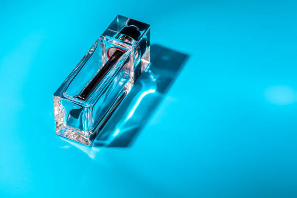 istock perfume glass bottle on light blue background. Eau de toilette 1429064763