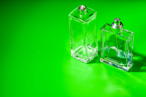 A group of glass bottles with various colors of perfumes