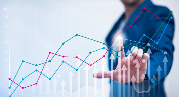 istock Analytics and financial, Changes in new planning chart concept, Businessman touch line of business market chart and arrows on the graph, indicating the economic recession that will occur in the world 1429064899