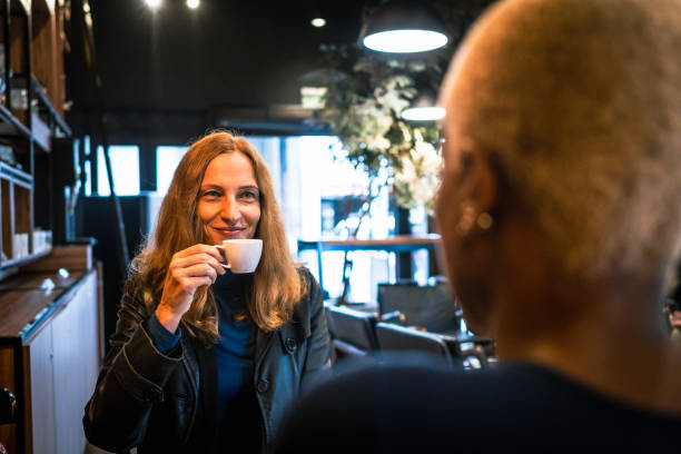 istock An Woman drinking coffee with coworker 1429071850