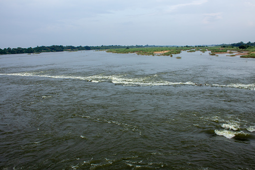 Water released into kaveri river from upper anaicut dam in Tamil Nadu. View of kaveri river flowing from Mukkombu, Trichy. Focus set on running water