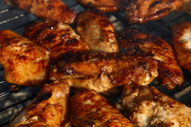 BBQ Chicken Wings with white souse and a beverage