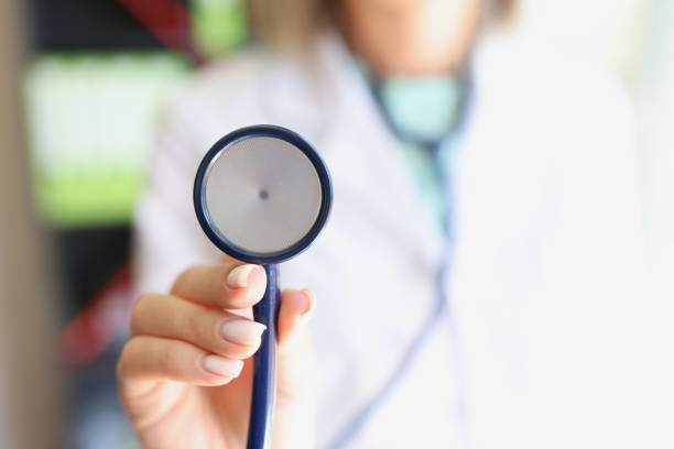 istock Female doctor holds stethoscope in hands closeup 1429076237