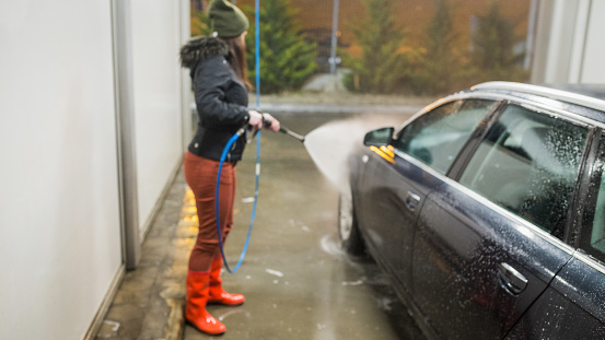 Woman washing the car