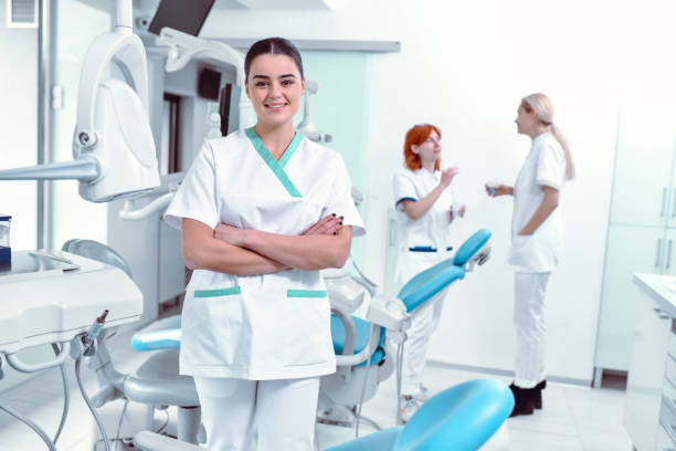 istock Beautiful Female Dentist And Her Assistants During Work Break 1429079011