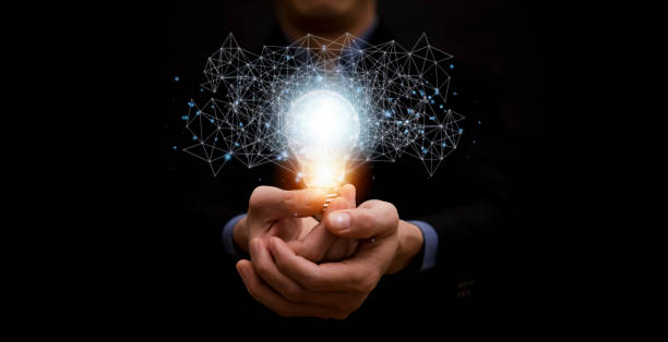 istock business hand holding illuminated light bulb, idea, innovation and inspiration concept.concept of creativity with bulbs that shine glitter, creativity with bulbs that shine glitter.Inspiration of idea 1429079432