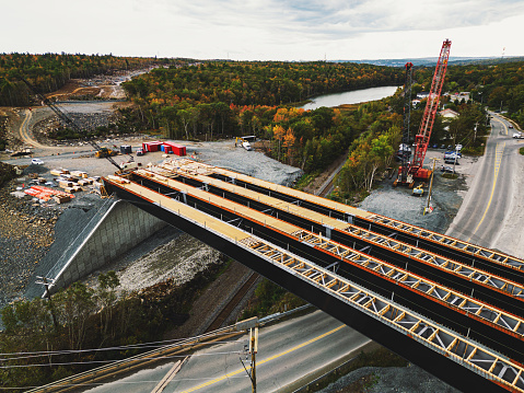 Aerial drone view of highway overpass construction site.