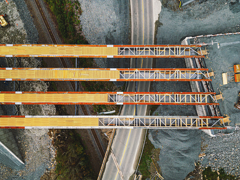 Aerial drone view of highway overpass construction site.