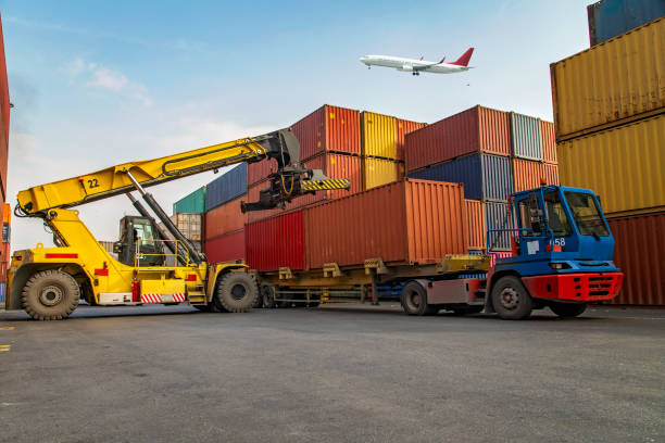 istock Airplane flying above container port. 1429088586