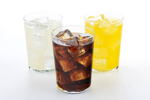 istock Glasses with soft drinks of cola, orange and lemon 1429088998