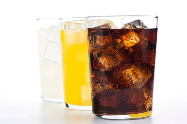 istock Glasses with soft drinks of cola, orange and lemon 1429089013