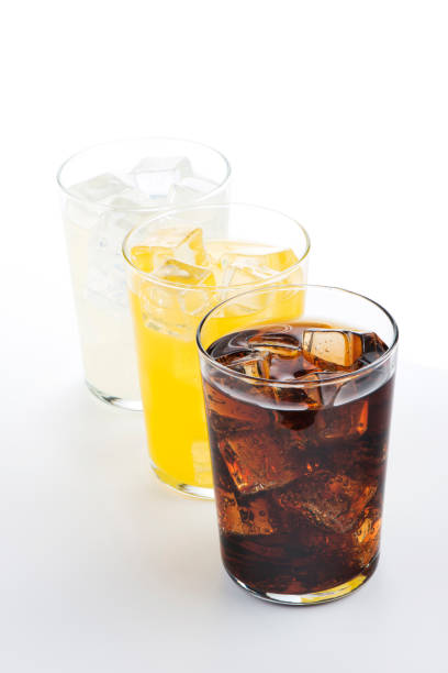 istock Glasses with soft drinks of cola, orange and lemon 1429089025