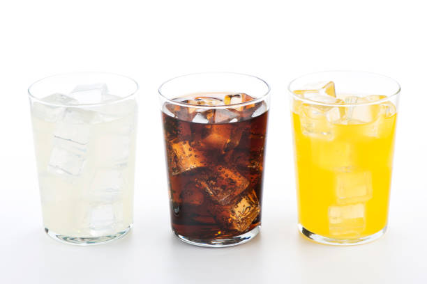 istock Glasses with soft drinks of cola, orange and lemon 1429089035