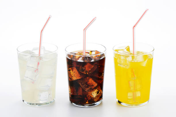 istock Cola, orange and lemon soda in glass with straw on white background 1429089048