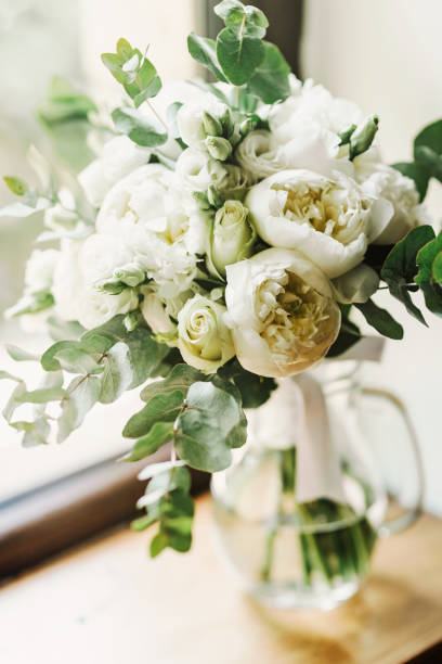 istock White bridal bouquet made of fresh peonies 1429089063