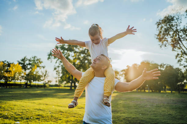 istock Father and daughter in the park 1429089165
