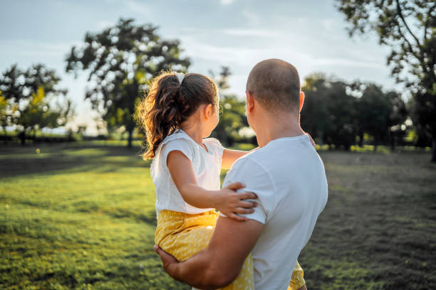istock Father and daughter in the park 1429089203
