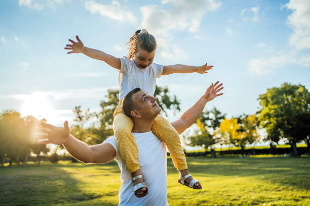 istock Father and daughter in the park 1429089228