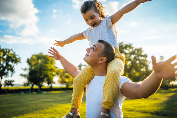 istock Father and daughter in the park 1429089256