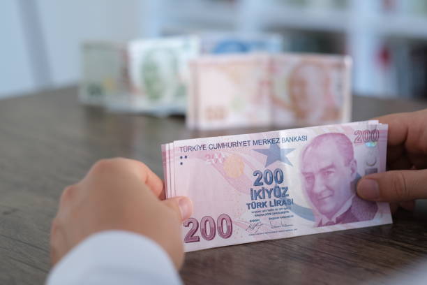 Hand Holding Two Hundred Turkish Banknotes stock photo
