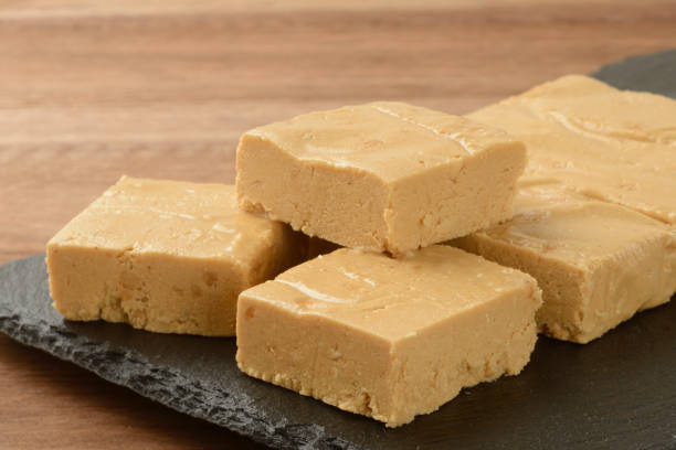 istock Soft nougat cut on a black plate 1429090875