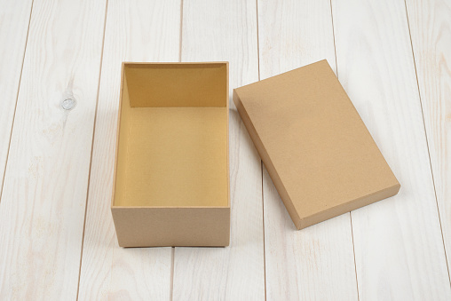 Rectangular gift box on wooden background