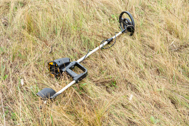 istock Man with electronic metal detector device working on outdoors. 1429093445