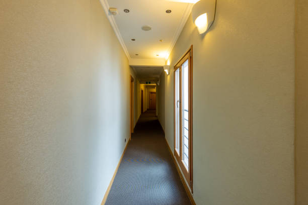 istock Interior of a hotel corridor with doors with room nummbers 1429095212
