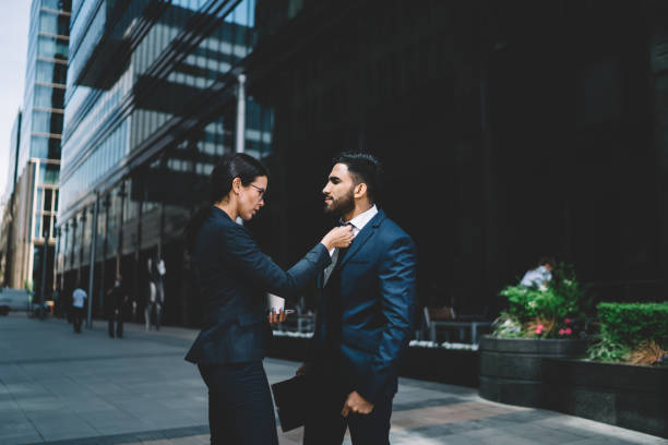 istock Colleagues in suits walking in street 1429097200