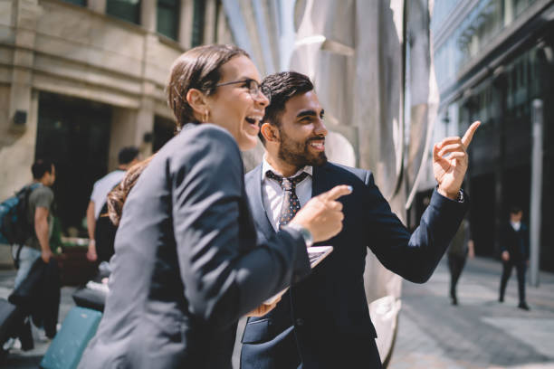 istock Happy elegant worker having fun with colleague in street 1429097252