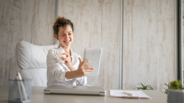 istock One woman working in the office and talk online using digital tablet 1429102753