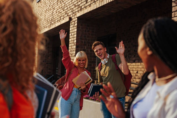 istock Students waving friends goodbye at campus. 1429108963