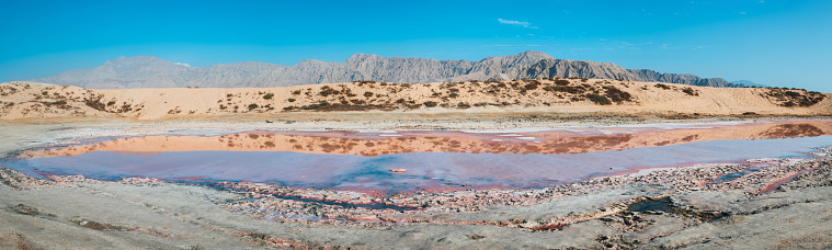Pink lake in Ras al Khaimah a natural phenomenon occurring in the water near seaside in the United Arab Emirates north emirate