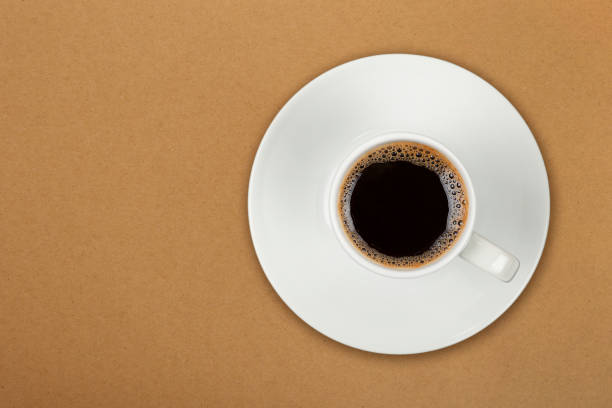 istock Full white espresso coffee cup over brown 1429114197