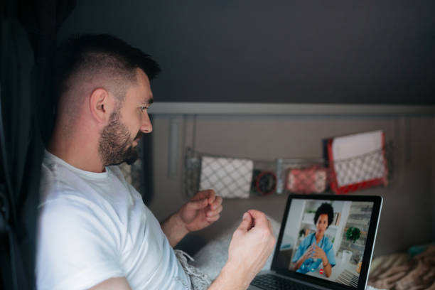 istock Trucker using a laptop to make a video call while on the road 1429114809