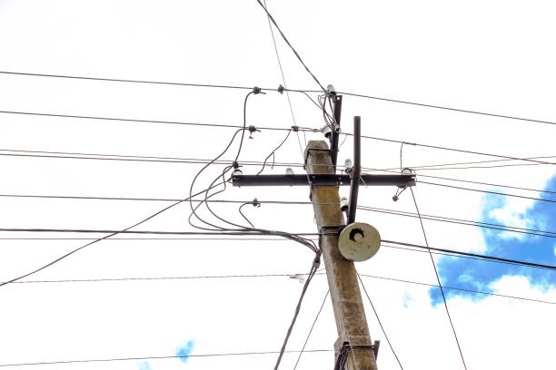 istock Electric pole power lines outgoing electric wires againts on cloud blue sky. 1429117845