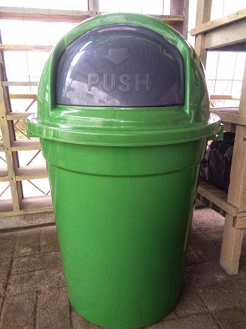 Wheeled Garbage Can of Gravesham Borough Council at Meopham in Kent, England, with a symbol visible.