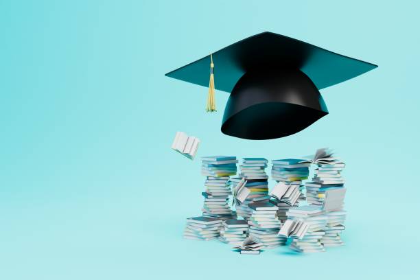 istock higher education concept. master's cap next to a pile of books on a blue background. copy paste. 3d render 1429125078