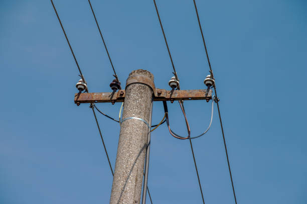istock Electric pole power lines outgoing electric wires againts on cloud blue sky. 1429125818