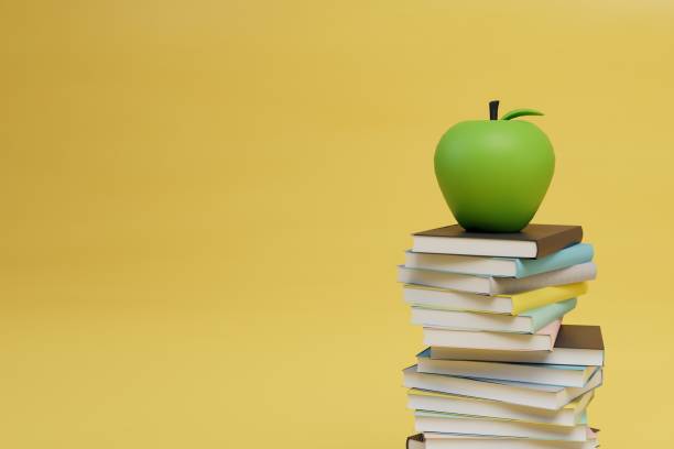 istock return to learning. snack during study. a stack of books and an apple on a yellow background. copy paste. 3d render 1429127058