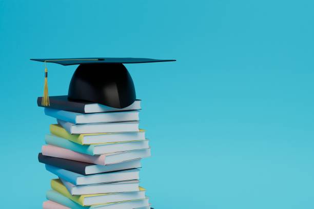 istock return to university studies. a stack of books and a graduation cap on a blue background. 3d render 1429127059