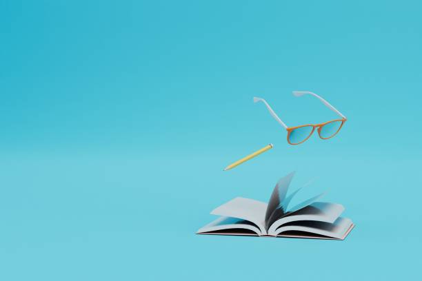 istock learning concept. glasses, pencil and open book on a blue background. copy paste, copy space. 3d render 1429127129