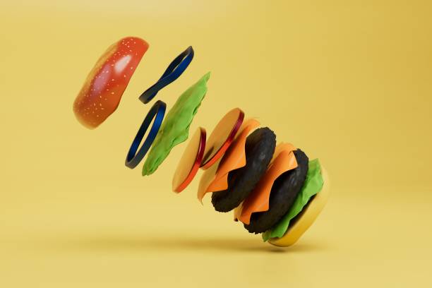 istock junk food, fast food. big cheeseburger flying on a yellow background. 3d render 1429127802