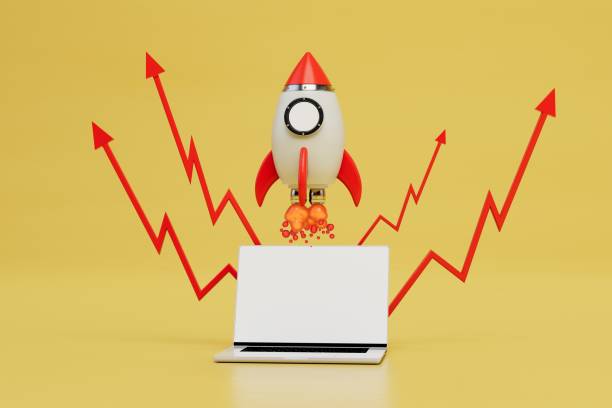 istock online earnings growth chart. laptop, taking off rocket and red arrows graphics on a yellow background. 3D render 1429128290