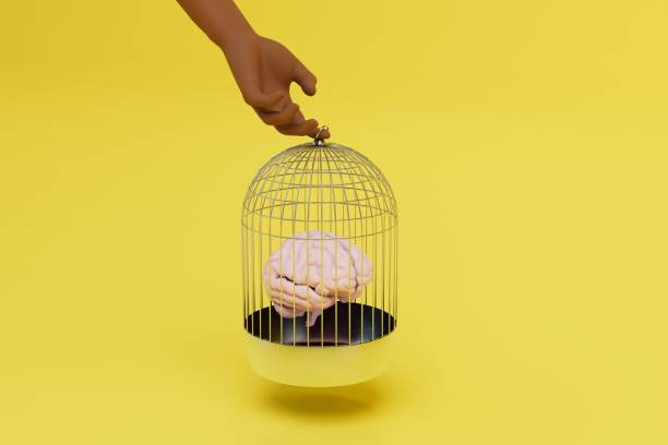 istock the brain cannot make a decision on its own. the arm holds the cell with the brain on a yellow background. 3D render 1429130489