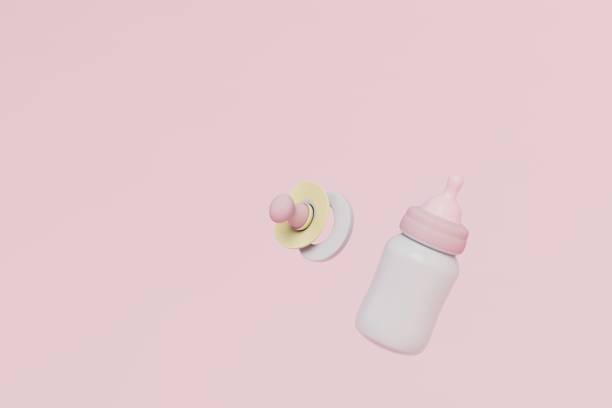 Baby milk bottle and pacifier on a pink pastel background. copy paste, copy space. 3d render.