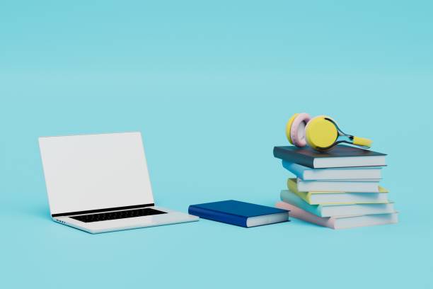 istock learning online with audiobooks. laptop, headphones and books on a blue background. 3d render 1429132082
