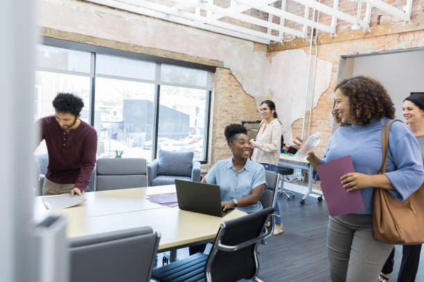 istock Female manager greets team arriving for design meeting 1429133038