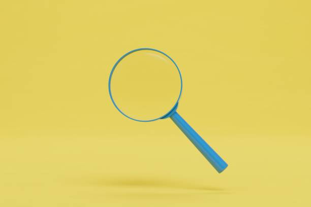 istock looking at objects in a magnifying glass. magnifier on a yellow background. 3D render 1429133362