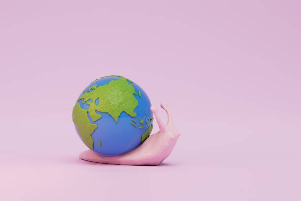 istock slow changes on the planet. a snail carrying a planet on a pink background. 3D render 1429134188